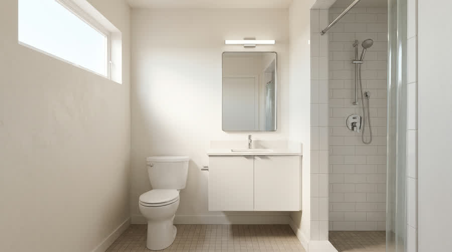CADU interior showing a tiled alcove shower with chrome trim.