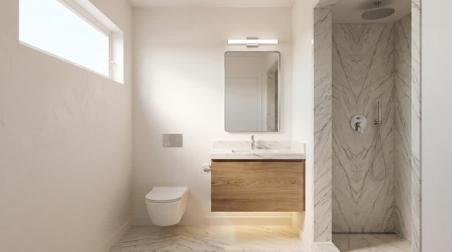 CADU interior showing a stone slab shower with a wall-hung toilet and a floating lit vanity.